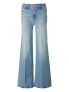 Light blue flared jeans on a white background