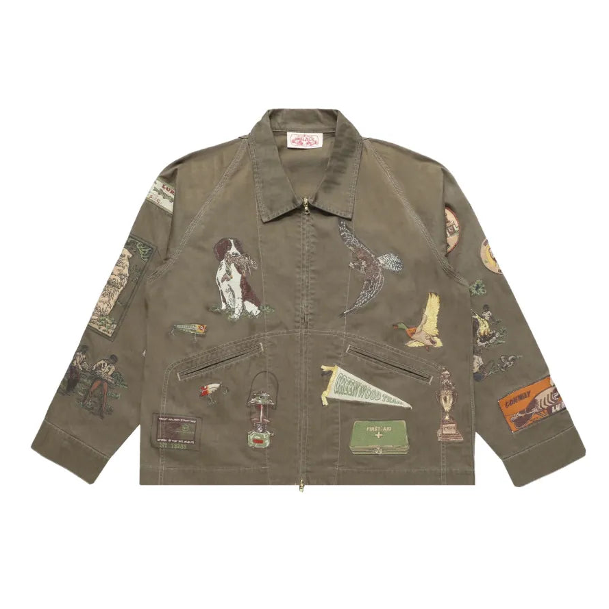 Green jacket with various patches on a white background