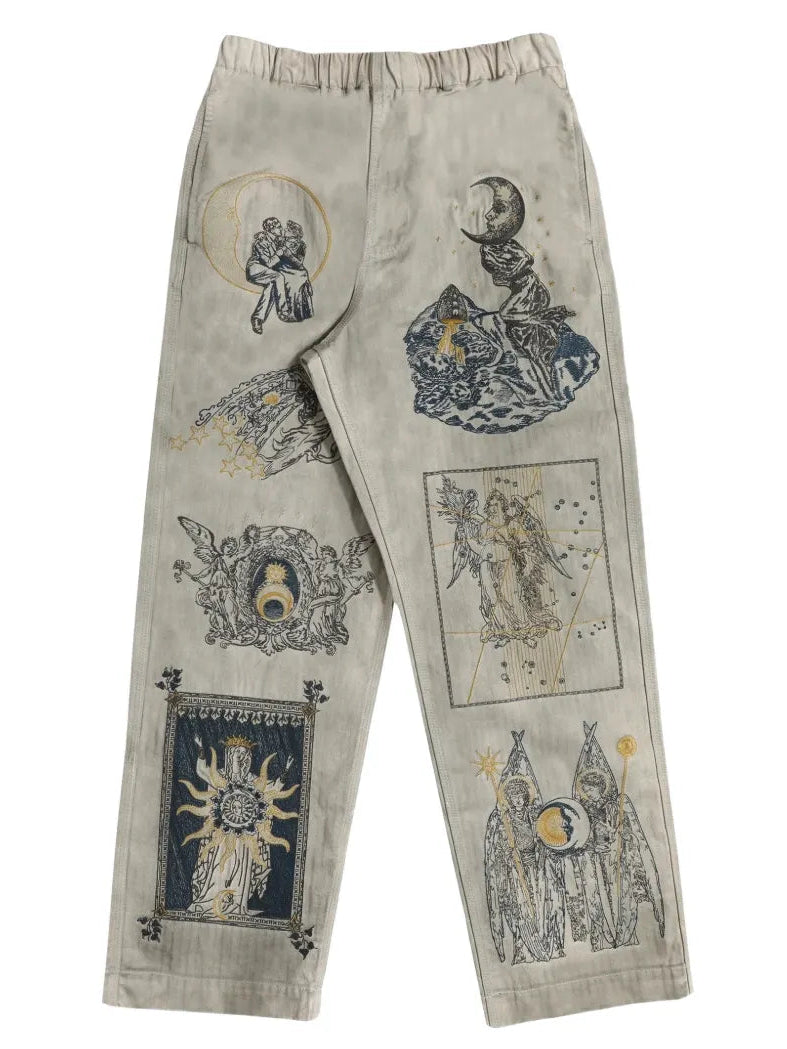 Light-colored pants with graphic designs on a white background