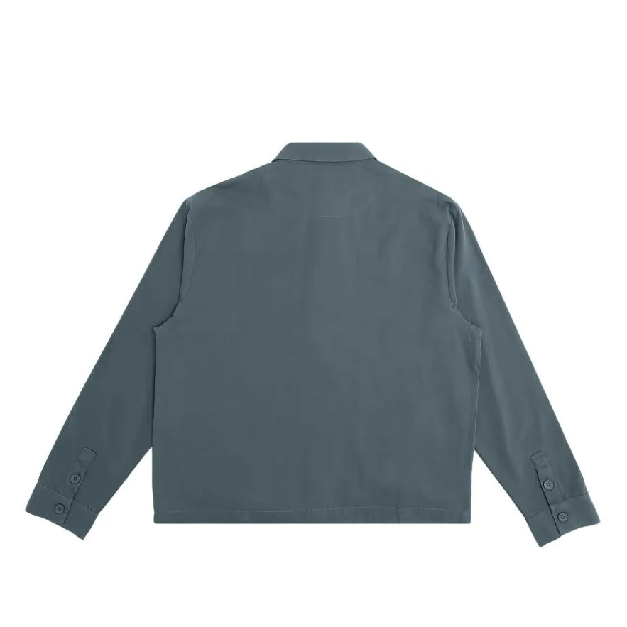 Back view of a teal shirt on a white background