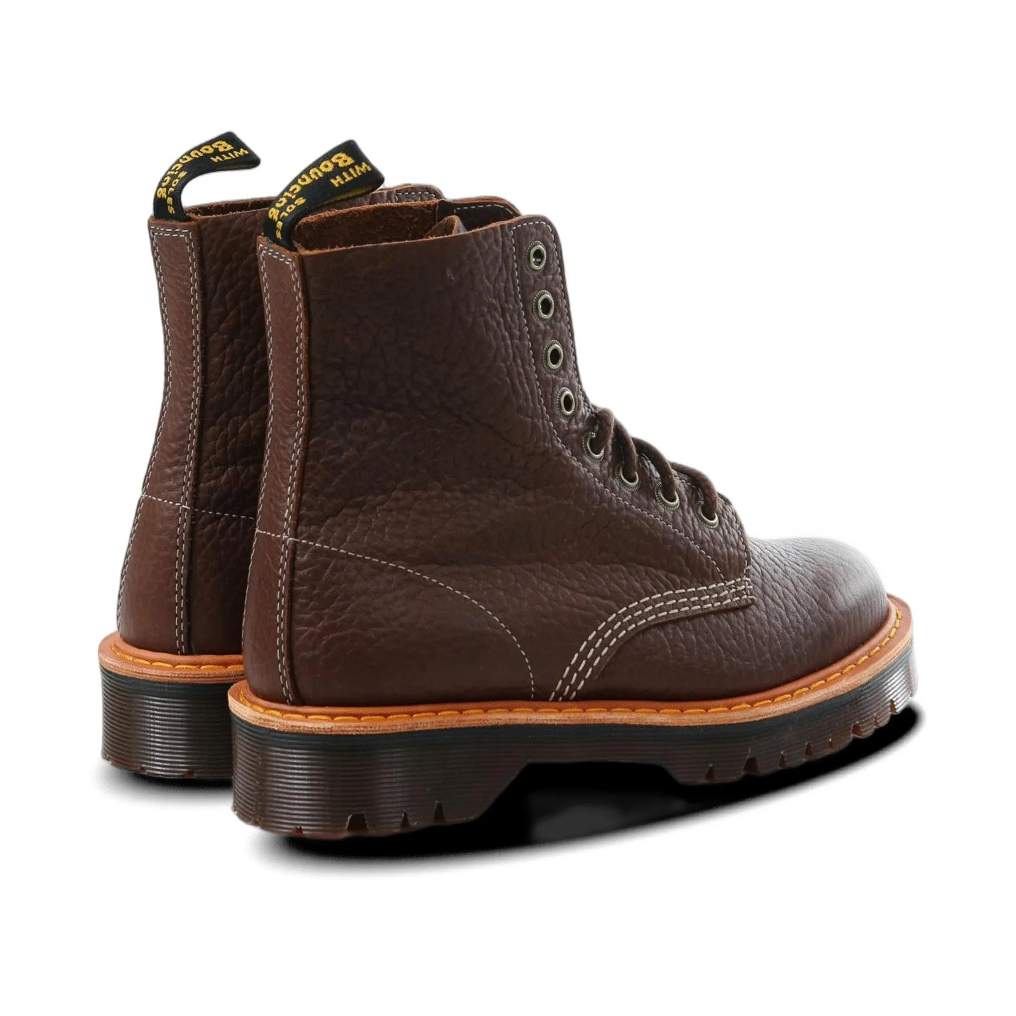 Brown leather boot with a white background