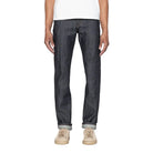 Person wearing dark blue jeans on a white background