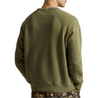Back view of the olive Red Rock Crewneck on a model, showing the raglan sleeves and ribbed hem.