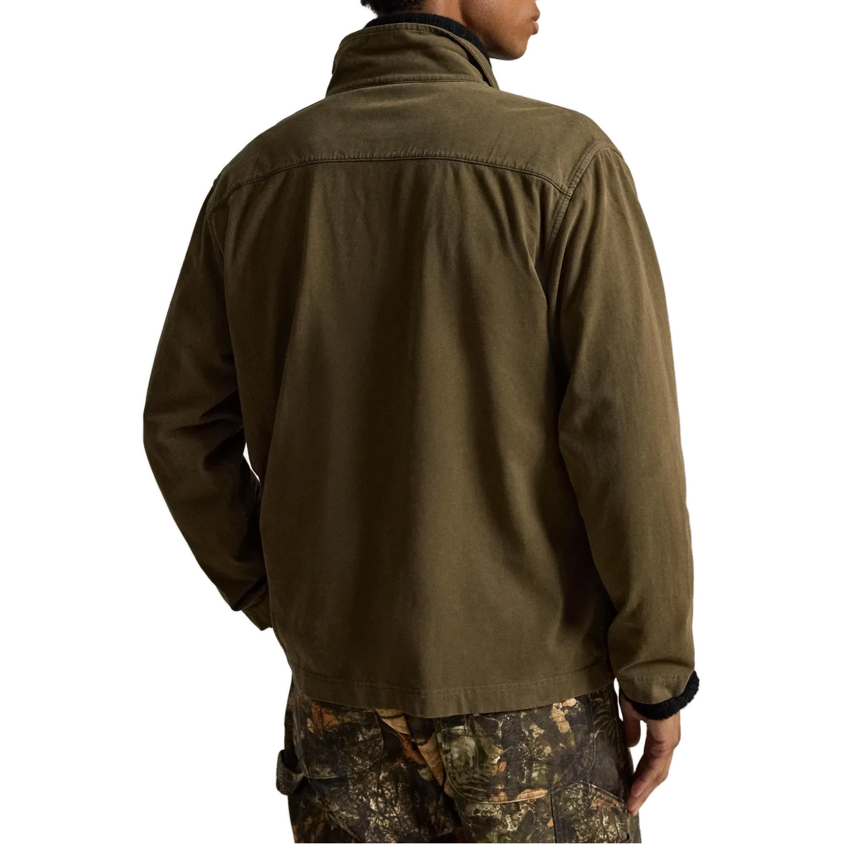 A man wearing an olive green lightweight jacket, shown from the back and side against a plain white background.