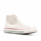 White canvas hi-top sneaker on a white background