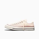 Cream sneaker on a white background