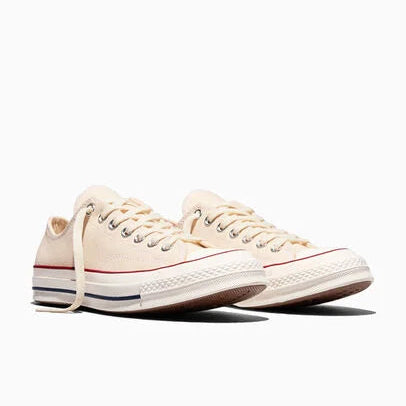 Cream sneakers on a white background