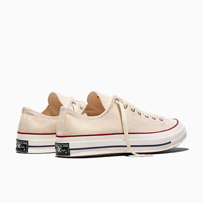 Cream sneakers on a white background