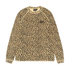 Front view of the Stüssy Basic Stüssy Thermal in leopard print laid flat. A long-sleeve waffle-knit top in a tan, black and rust leopard print with raglan sleeves and a small black Stüssy logo on the chest.