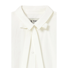 Close-up of the collar on The Tiny Big Sister Bow Neck Shirt, showing the bow at the neck, the brand label and a button on the front.