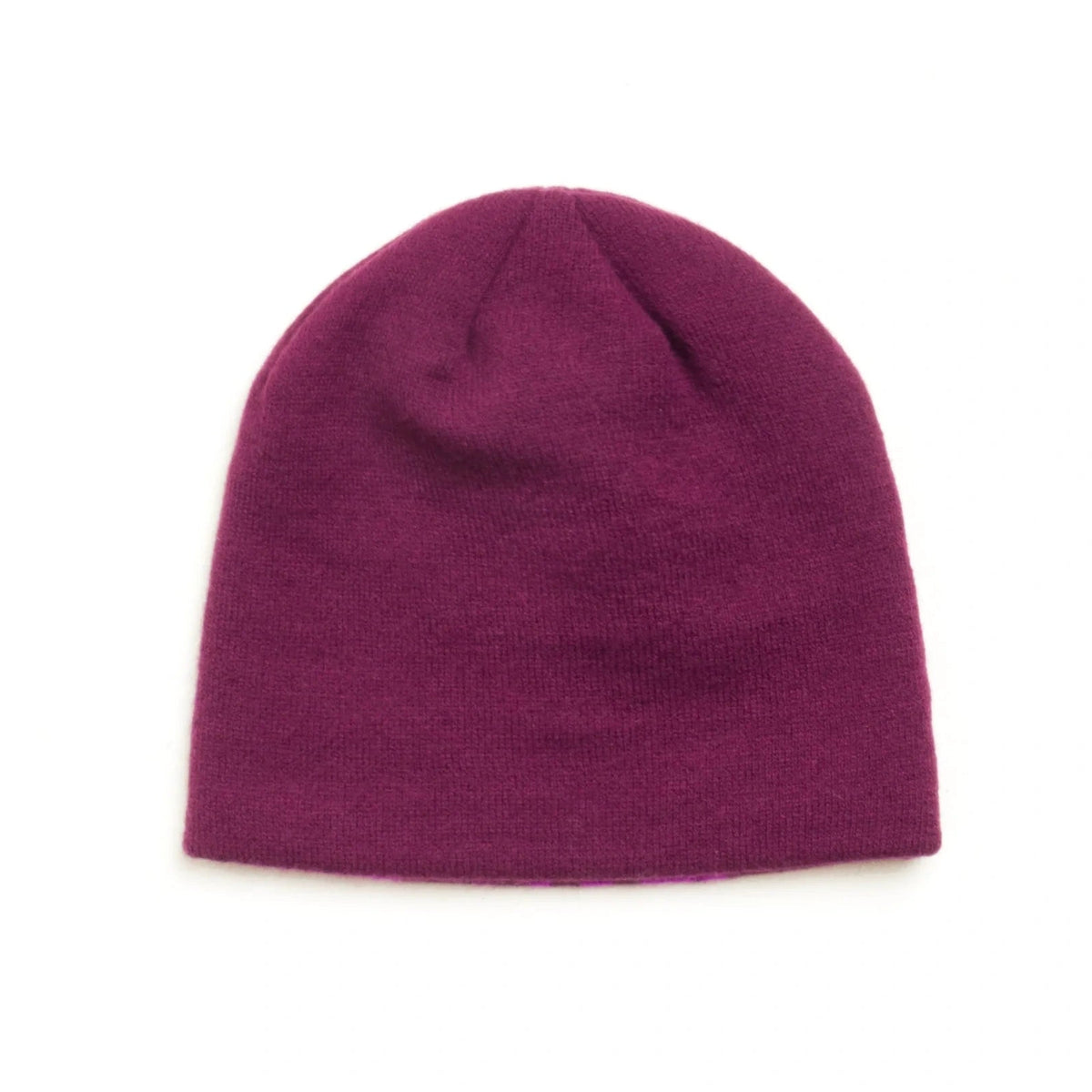 A classic knit beanie hat in a deep plum purple color, photographed flat against a solid white background.