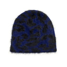 A fuzzy knit beanie hat featuring a dark blue and black leopard print pattern, shown against a plain white background.