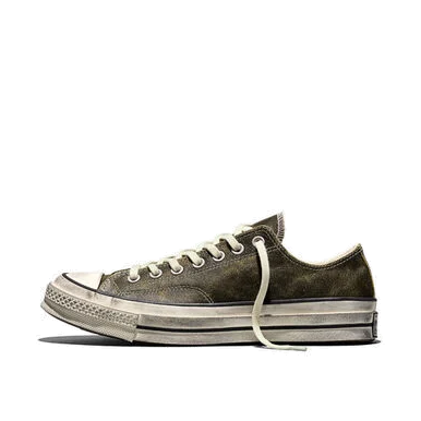 Side view of a Converse Chuck 70 low-top in moss-green burnished leather on a white background, with a scuffed egret midsole, black stripe and cream laces.