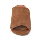 A single brown slide sandal with a textured, hair-on-hide style upper, shown from a top-down view on a white background.