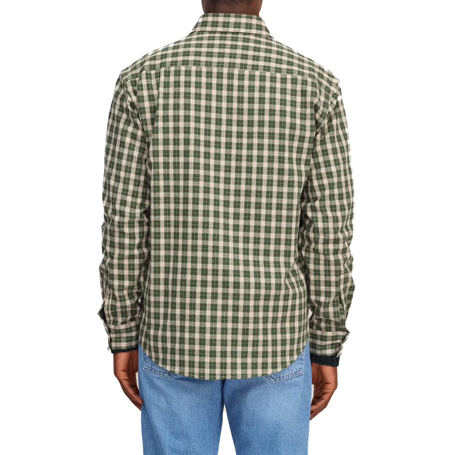 Back view of the green and cream check shirt on a model, worn with light-wash jeans