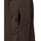 Chest Pocket Detail: Close-up of the open chest pocket on a dark brown Snow Peak Flexible Insulated Cardigan, showing the small zip pull inside the pocket and the snap buttons along the front.