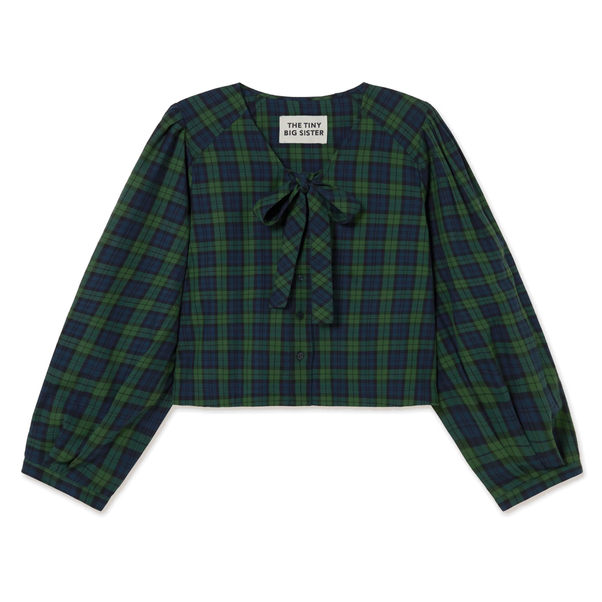 Front view of The Tiny Big Sister Green Check Bow Blouse laid flat on white, showing the green and navy check, V-neck tied with a bow, button front and full balloon sleeves.
