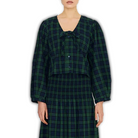 Model wearing The Tiny Big Sister Green Check Bow Blouse with a matching smocked maxi skirt.