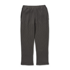 Front view of charcoal Snow Peak Heavyweight Waffle Pants laid flat on white, showing the elastic waistband, side pockets, straight legs and waffle-knit texture.