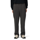 Front view of a model wearing charcoal Snow Peak Heavyweight Waffle Pants with a black long-sleeve top and beige suede slip-on shoes, showing the straight-leg fit.