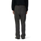 Back view of a model wearing charcoal Snow Peak Heavyweight Waffle Pants, showing the elastic waist, single back patch pocket and straight legs.