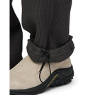 Close-up of the rolled hem on charcoal Snow Peak Heavyweight Waffle Pants, showing the elastic drawcord adjuster above a beige suede shoe.