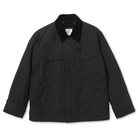 Front view of a black Snow Peak Hybrid Takibi Adjustable Jacket laid flat on white, showing the black corduroy collar, two flap chest pockets, covered front placket and button-tab cuffs.