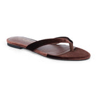 A single brown thong sandal with a velvet strap and a suede-like footbed, shown from a side profile on a white background.