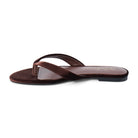 A single dark brown flat thong sandal with a suede-like finish, shown from a side profile view on a clean white background.