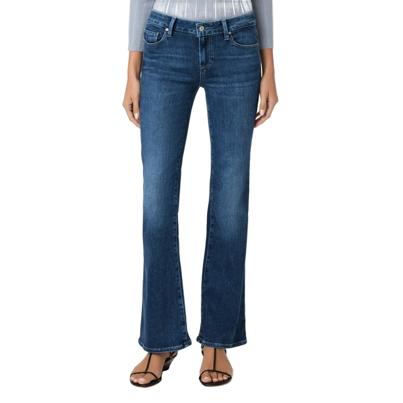 A model wearing a pair of medium-wash blue flare jeans, styled with a light gray top and black strappy sandals, shown against a plain white background.