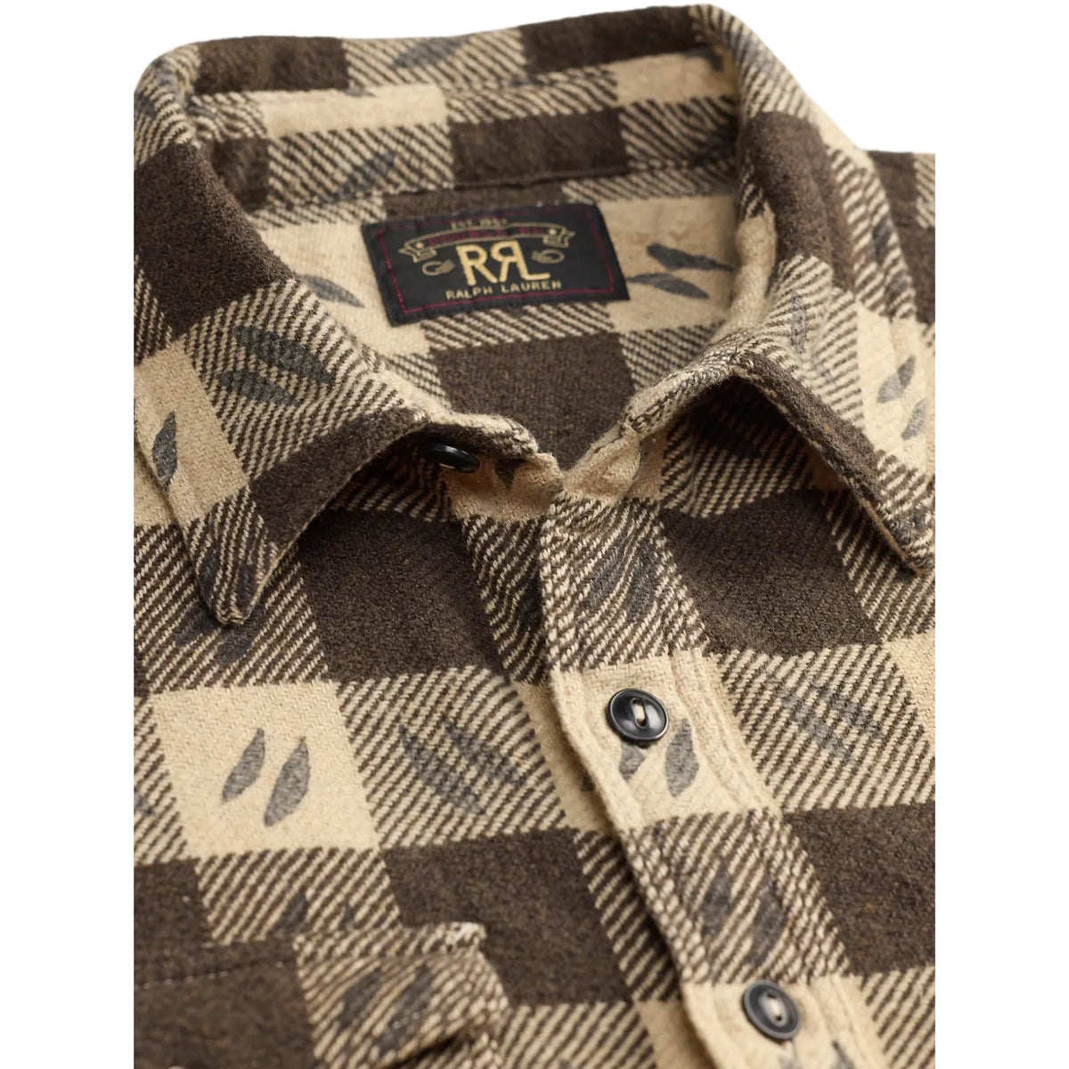Close-up of a RRL plaid flannel shirt in brown and beige with a small leaf pattern, featuring a button-down front and a visible RRL neck label.