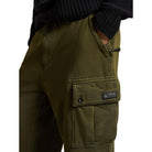 Close-up of the cargo pocket on the olive fleece pant, showing the button flap and the Polo Ralph Lauren Outdoors “Expedition Equipment” patch.