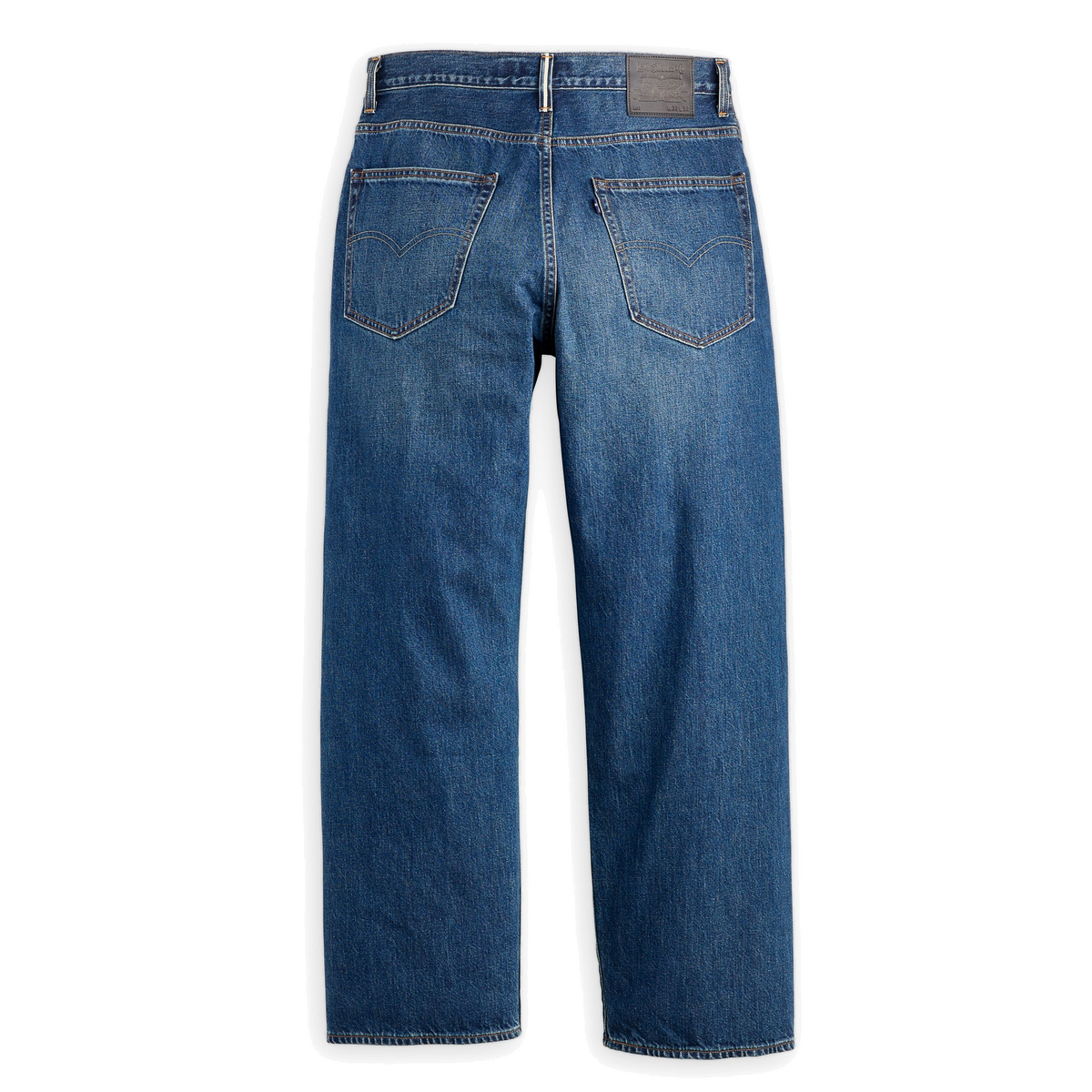 Levi’s Blue Tab Marker Loose Selvedge Jeans in dark indigo, back view laid flat on white, showing a leather-look waistband patch and arcuate-stitched back pockets.