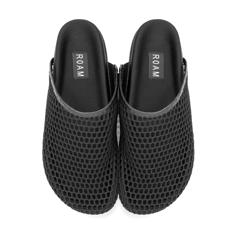 Top-down view of a pair of black ROAM Mesh Clogs, showing the mesh toe boxes, black footbeds and ROAM logo labels.