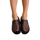 Front view of bare legs wearing black ROAM Mesh Clogs, with the toes showing through the open mesh upper.
