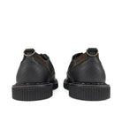 Back view of the pair, showing the pebble-grain leather heels, the metal D-rings and the ribbed platform soles.