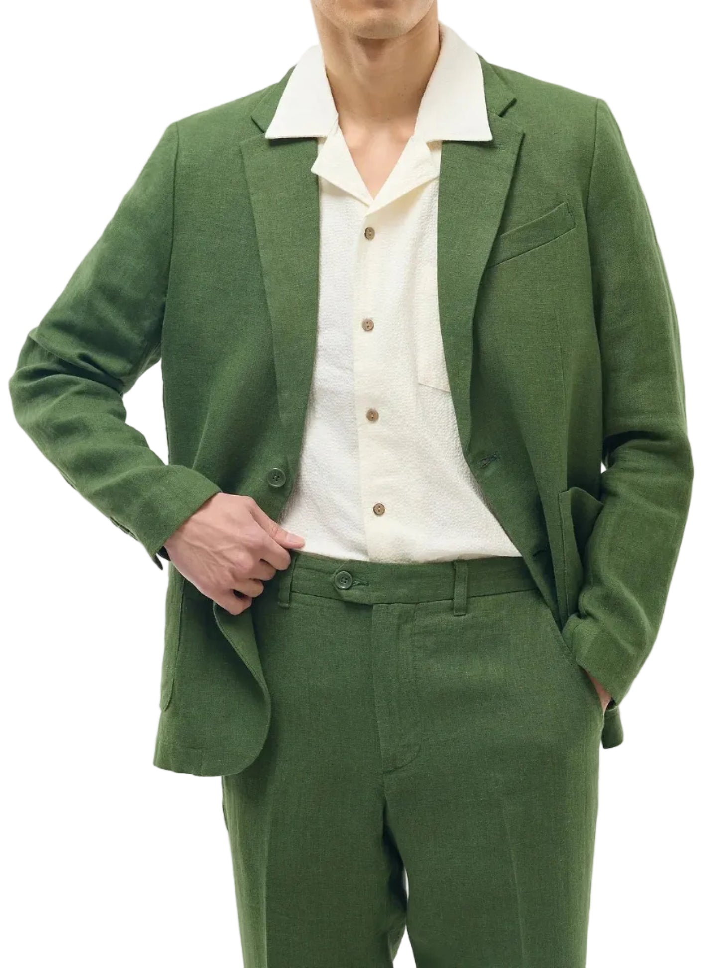 Man wearing a green suit with a white shirt on a light gray background