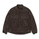 Front view of a dark brown Snow Peak Pertex Quantum Air Jacket, laid flat on white, showing the stand collar, concealed front placket, two large chest flap pockets, elastic cuffs and a curved hem.
