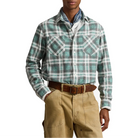 A model wears the Plaid Flannel Workshirt tucked into tan work pants with a brown leather belt and a blue paisley bandana.