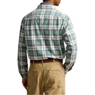 Back view of the Plaid Flannel Workshirt on a model, showing the back yoke and the green and gray plaid, worn with tan work pants.