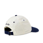 A Polo Ralph Lauren baseball cap shown from the back, featuring an off-white crown, a navy blue visor, and a navy blue adjustable strap with a silver buckle. The 'Polo Ralph Lauren' brand name is embroidered in navy on the side.