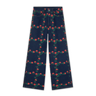 Front view of The Tiny Big Sister Roses Grid Embroidery Berta Long Jeans laid flat on white, showing the dark-wash denim with red rose and green leaf embroidery in a grid, and the wide straight legs.