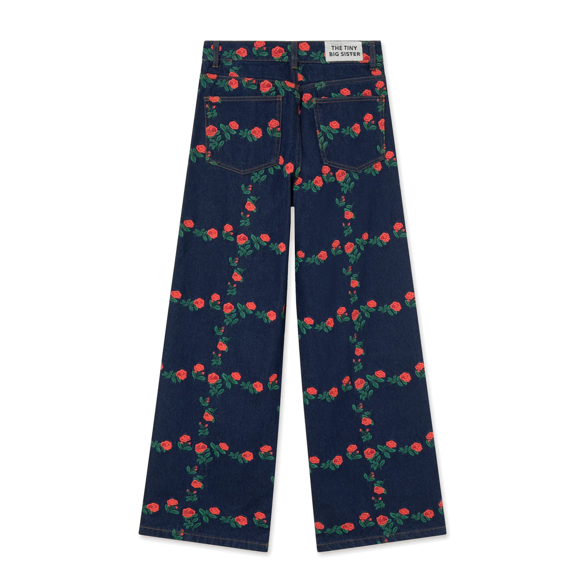 Back view of The Tiny Big Sister Roses Grid Embroidery Berta Long Jeans laid flat on white, showing the patch pockets, brand label on the waistband and all-over rose embroidery.