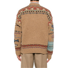 Back view of the Scenic Wool Cardigan on a model, showing the Fair Isle yoke and hem bands and the fish motifs on the sleeves.