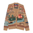 Polo Ralph Lauren Scenic Wool Cardigan laid flat. A camel V-neck cardigan knit with a countryside scene of a red farmhouse, trees, sheep and a fisherman in a boat, with Fair Isle bands and “Ralph Lauren” lettering.