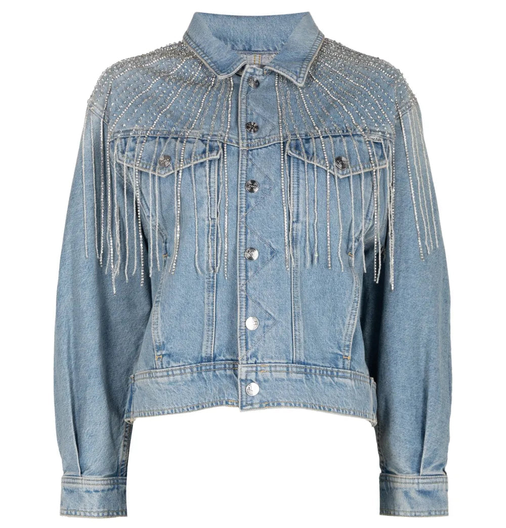 A light blue denim jacket featuring fringe detailing across the chest and shoulders, button-front closure, and flap chest pockets, shown on a plain white background.