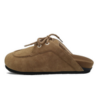 Side view of a ROAM Moc Loafer mule in taupe vegan nubuck on white, showing the open back, laced moccasin apron with stitching and the black sole.