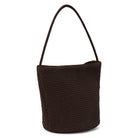 Brown woven handbag on a white background