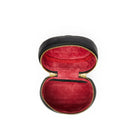 An open oval purse with a black textured exterior, gold-tone zipper, and a deep red velvet interior, shown against a plain white background.