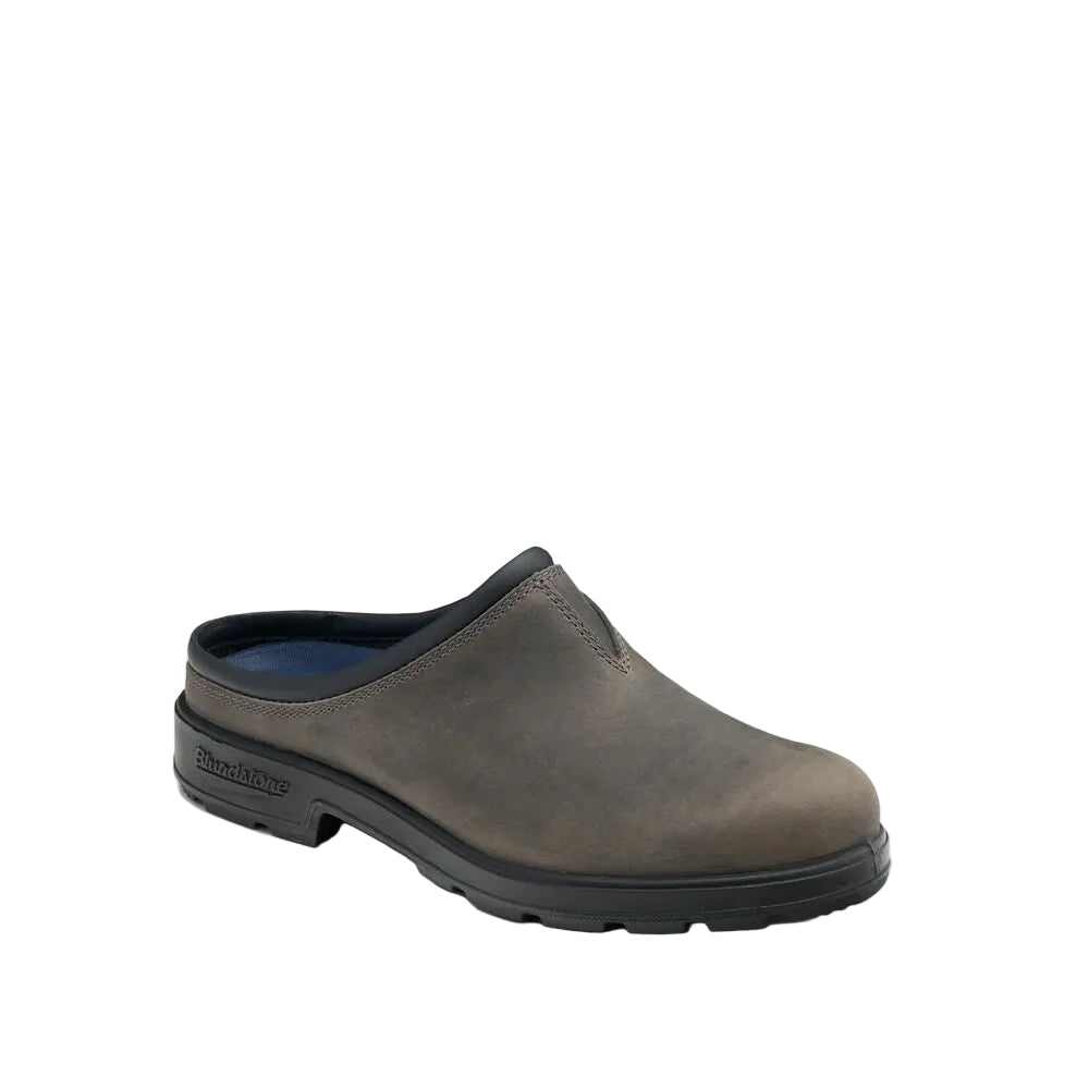Gray slip-on shoe with black sole on a white background